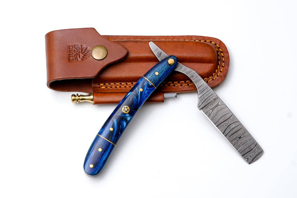 Damascus straight razor with blue resin handle